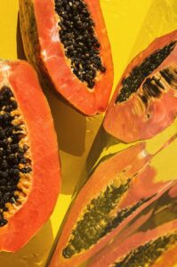 Pods of split papaya fruit displaying the seeds