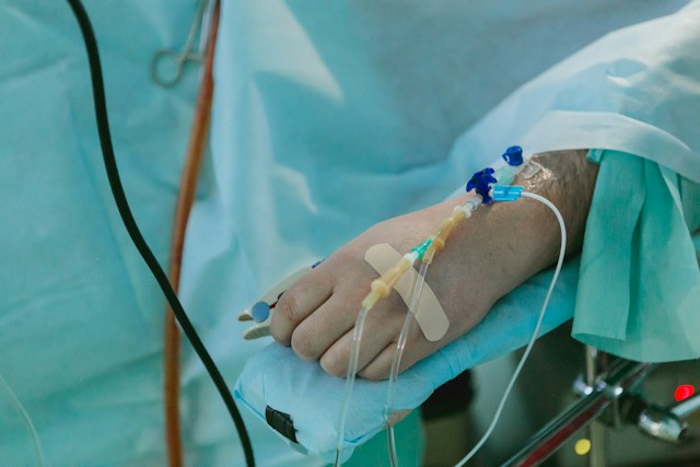 A sick patient getting drips in a hospital