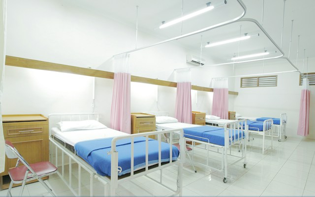 A hospital ward with beds